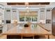 Bright, spacious kitchen featuring a large center island, modern appliances, and plenty of storage space at 115 S Glencoe, Denver, CO 80246