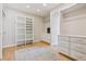 Spacious walk-in closet with custom shelving, drawers, and plenty of storage space at 115 S Glencoe, Denver, CO 80246