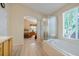 Relaxing main bathroom with soaking tub, glass enclosed shower, and access to the bedroom at 13088 Jersey St, Thornton, CO 80602