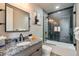 Well-lit bathroom with a granite countertop vanity, a glass-enclosed shower, and modern fixtures at 436 N Fuller Placer Rd, Breckenridge, CO 80424