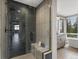 Open bathroom concept with a shower and vanity, with an attached bathtub area next to the window at 436 N Fuller Placer Rd, Breckenridge, CO 80424