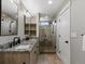 Modern bathroom featuring double sinks, granite countertops, and a glass-enclosed shower at 436 N Fuller Placer Rd, Breckenridge, CO 80424