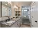 Modern bathroom features a double vanity with gray marble countertops and a glass shower at 436 N Fuller Placer Rd, Breckenridge, CO 80424