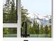 View of the mountains from the bathtub next to a large picture window at 436 N Fuller Placer Rd, Breckenridge, CO 80424