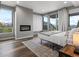 Bedroom featuring a fireplace, a neutral color palette, and views of the surrounding mountains at 436 N Fuller Placer Rd, Breckenridge, CO 80424