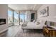 Bright bedroom with a fireplace, large windows offering scenic views, and contemporary decor at 436 N Fuller Placer Rd, Breckenridge, CO 80424