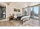 Cozy bedroom featuring an outdoor balcony, hardwood floors and modern decor at 436 N Fuller Placer Rd, Breckenridge, CO 80424
