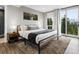 Spacious bedroom with a large bed, balcony access, and scenic mountain views at 436 N Fuller Placer Rd, Breckenridge, CO 80424