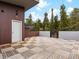 Expansive wood-tiled deck area offers outdoor living space with wooded views and a private entrance at 436 N Fuller Placer Rd, Breckenridge, CO 80424
