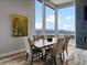 Dining area with table, chairs and large windows with mountain views and modern painting at 436 N Fuller Placer Rd, Breckenridge, CO 80424