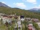 A view of an upscale mountain community with beautiful homes surrounded by evergreen trees and mountain views at 436 N Fuller Placer Rd, Breckenridge, CO 80424