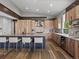 Full kitchen view with stainless steel appliances, island, seating, countertops and wood cabinets at 436 N Fuller Placer Rd, Breckenridge, CO 80424