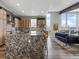 Open-concept kitchen with granite island, stainless steel appliances, and views of the mountains in the background at 436 N Fuller Placer Rd, Breckenridge, CO 80424