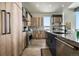 Modern kitchen featuring wood cabinets, granite counters, and stainless steel appliances at 436 N Fuller Placer Rd, Breckenridge, CO 80424