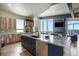 Spacious kitchen with island, stainless appliances, wood floors, and open floor plan at 436 N Fuller Placer Rd, Breckenridge, CO 80424