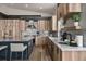 Modern kitchen features wood cabinetry, granite countertops, and stainless appliances at 436 N Fuller Placer Rd, Breckenridge, CO 80424