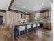 Modern kitchen featuring stainless steel appliances, gray countertops, wood cabinets and a large island with seating at 436 N Fuller Placer Rd, Breckenridge, CO 80424