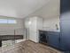 Small kitchen with a stainless steel refrigerator and beverage cooler next to a kitchenette sink at 436 N Fuller Placer Rd, Breckenridge, CO 80424