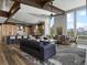 Open concept living room featuring modern furnishings, fireplace and mountain views at 436 N Fuller Placer Rd, Breckenridge, CO 80424