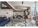 Open concept living room and kitchen area with hardwood floors and modern appliances at 436 N Fuller Placer Rd, Breckenridge, CO 80424