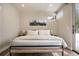 Relaxing bedroom with large bed, mountain view art, and wood-look flooring at 436 N Fuller Placer Rd, Breckenridge, CO 80424