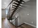 Modern staircase with wooden steps and metal railings, providing a stylish transition between floors at 436 N Fuller Placer Rd, Breckenridge, CO 80424