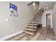 Modern staircase with wood steps, black metal railings, and light wood floors creating a stylish interior at 436 N Fuller Placer Rd, Breckenridge, CO 80424