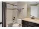 Clean bathroom with tub, shower, granite countertop, and neutral finishes at 10167 Nadine Ave, Parker, CO 80134