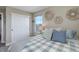 Comfortable bedroom with a large sliding door closet, light and airy feel, plus neutral wall decor at 10167 Nadine Ave, Parker, CO 80134
