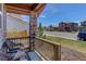 Cozy front porch seating area offers neighborhood views and a relaxing outdoor space at 10167 Nadine Ave, Parker, CO 80134