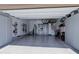 Spacious garage featuring epoxy floor, storage cabinets, and overhead bicycle racks at 10167 Nadine Ave, Parker, CO 80134