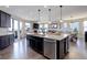 Spacious kitchen with stainless steel appliances, granite countertops, and an open layout to the living and dining areas at 10167 Nadine Ave, Parker, CO 80134