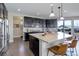 Modern kitchen features stainless steel appliances, granite countertops, and a large center island with bar seating at 10167 Nadine Ave, Parker, CO 80134
