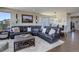 Spacious living room features hardwood floors, recessed lighting, and an open layout to the dining area at 10167 Nadine Ave, Parker, CO 80134