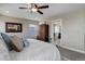 Comfortable primary bedroom with carpeted floor, furniture, and ensuite bathroom access at 10167 Nadine Ave, Parker, CO 80134