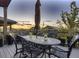 Elegant outdoor patio features an ornate dining table and chair set, ideal for dining at 10167 Nadine Ave, Parker, CO 80134