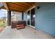Outdoor hot tub and stairs on a concrete patio, next to sliding glass door at 8609 Cheraw St, Littleton, CO 80125