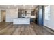 Modern kitchen with stainless steel appliances, white countertops, and stylish gray cabinetry at 8609 Cheraw St, Littleton, CO 80125