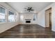 Inviting living room with a modern fireplace, large windows, and hardwood floors at 8609 Cheraw St, Littleton, CO 80125