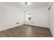 Bedroom featuring hardwood floors, natural lighting, and updated fixtures at 1370 S Idalia St # A, Aurora, CO 80017