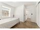 Sun-filled bedroom with hardwood floors and staircase entrance at 1370 S Idalia St # A, Aurora, CO 80017