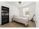 Bright bedroom with large window, hardwood floors, and modern finishes at 1370 S Idalia St # A, Aurora, CO 80017