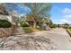 Townhome exterior with mature trees and private parking spaces at 1370 S Idalia St # A, Aurora, CO 80017