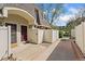 Charming townhome exterior with private courtyard and a dark purple front door at 1370 S Idalia St # A, Aurora, CO 80017