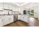 Eat-in kitchen featuring stainless steel appliances, stone countertops and sliding door at 1370 S Idalia St # A, Aurora, CO 80017