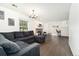 Bright living room featuring hardwood floors, a fireplace, and access to a workspace at 1370 S Idalia St # A, Aurora, CO 80017