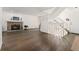 Open living room with a stone fireplace, staircase, and hardwood floors for a modern feel at 1370 S Idalia St # A, Aurora, CO 80017