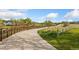 Scenic paved path with sturdy railings winding through a lush green landscape under a blue sky at 1370 S Idalia St # A, Aurora, CO 80017