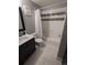 Bathroom featuring shower-tub combination with tiled walls, sleek vanity, and updated fixtures at 1863 S Pitkin Cir # B, Aurora, CO 80017