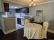 Dining area with chandelier, adjacent to kitchen, with table and chairs at 1863 S Pitkin Cir # B, Aurora, CO 80017